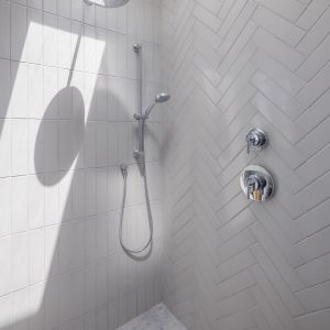 Bright white geometric modern bathroom shower tile head chrome shiny clean marble clay new home