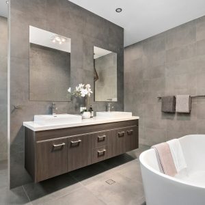 Sleek, contemporary home bathroom with white fixtures